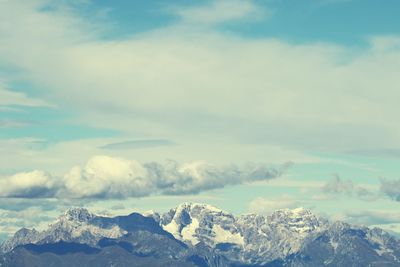 Scenic view of snow mountains against sky