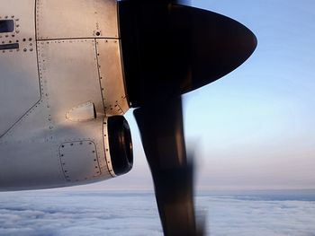 Close-up of propeller airplane against sky