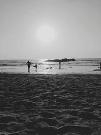 Silhouette of people on beach