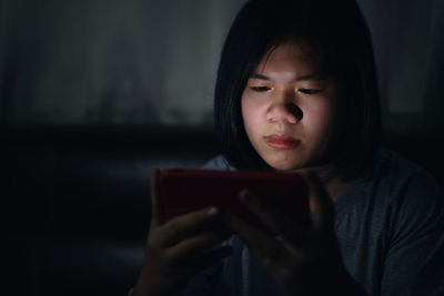 Portrait of teenage girl using mobile phone