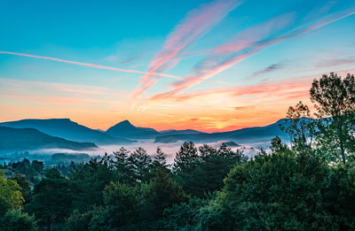 Scenic view of mountains against sky during sunset