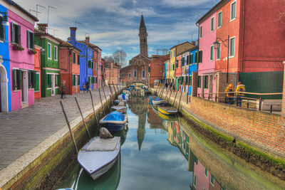 Panoramic view of canal amidst buildings in city