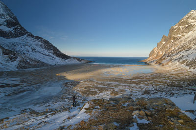 Scenic view of sea against sky during winter