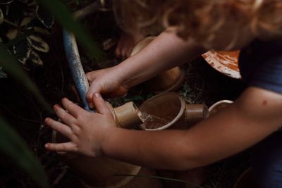 Close-up of woman holding water