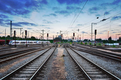 View of railroad tracks against cloudy sky