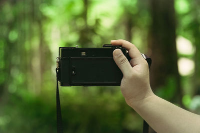 Close-up of hand holding camera