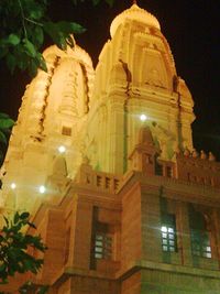 Low angle view of illuminated building at night