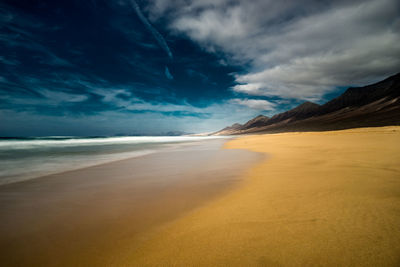 Scenic view of beach against sky