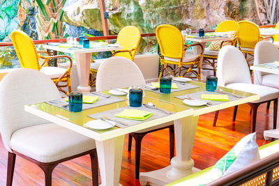 Empty chairs and tables in restaurant