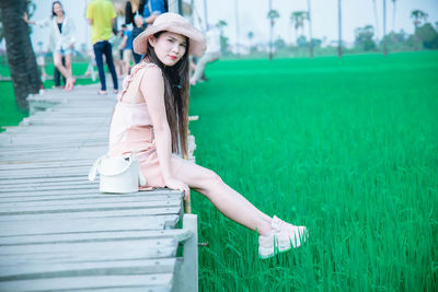 Full length portrait of woman wearing hat