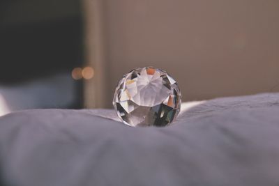 Close-up of a glass with reflection on table