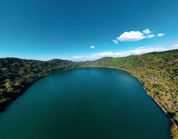 Scenic view of lake against blue sky