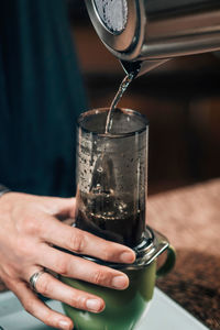 Barista brewing air press coffee