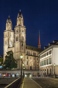 View of buildings in city at night