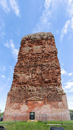 Low angle view of old ruin building against sky