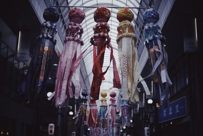 Low angle view of lanterns hanging against ceiling