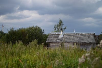 Built structure on field against sky