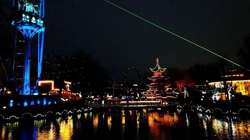 Illuminated buildings in city at night
