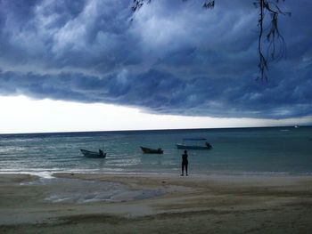 Scenic view of sea against cloudy sky