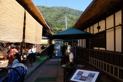 People in front of buildings