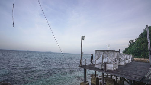 Pier over sea against sky