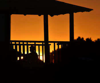 Silhouette people against sky during sunset