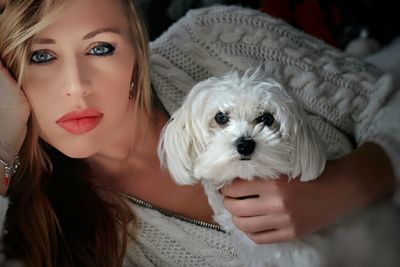 Portrait of young woman with dog