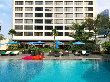 View of swimming pool against buildings