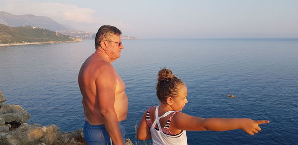 Father and son at sea shore