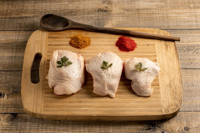 High angle view of fish on cutting board