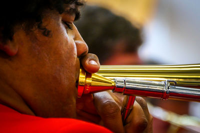 Close-up of man playing guitar