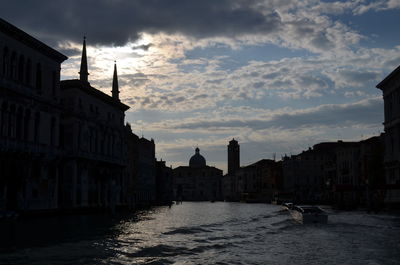 Scenic view of canal grande amidst buildings in city