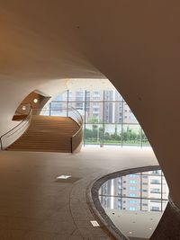 Low angle view of building seen through glass window