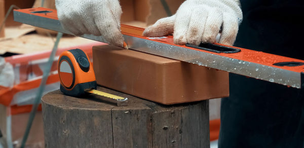 Close-up of man working on wood
