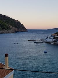 Scenic view of sea against clear sky during sunset