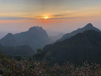 Scenic view of mountains against sky during sunset