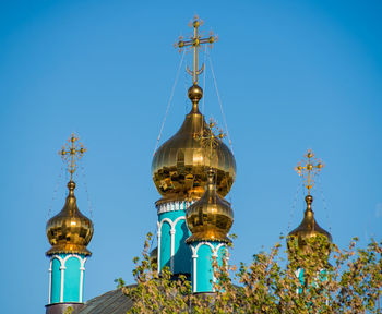 Low angle view of traditional building against clear blue sky