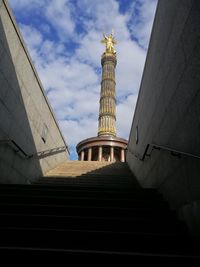 Low angle view of building against cloudy sky