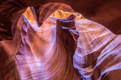Rock formation that looks like a fist punching through the sandstone in antelope canyon