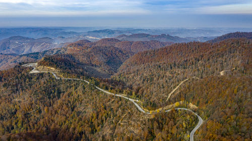 Aerial view of landscape against cloudy sky