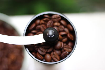 Close-up of coffee beans in bowl on table