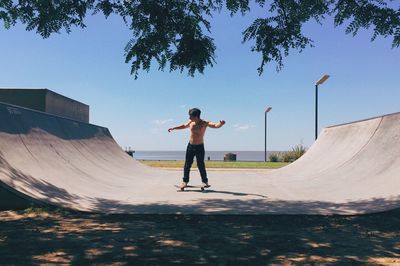 Full length of man skating against sky