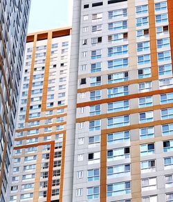 Low angle view of modern building in city against sky