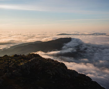 Little bigelow mountain at sunrise rising above the morning mist