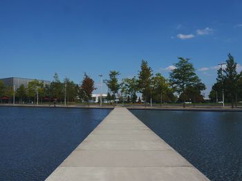 View of swimming pool against clear blue sky