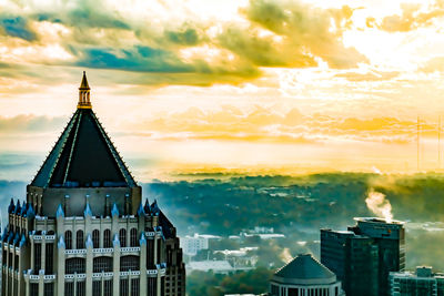 View of buildings against sky during sunset