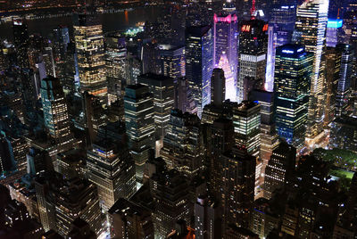 Aerial view of illuminated buildings in city at night