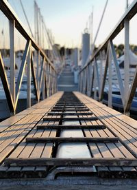 Surface level of footbridge against sky