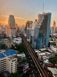 High angle view of buildings in city against sky during sunset