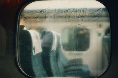 Reflection of train on glass window